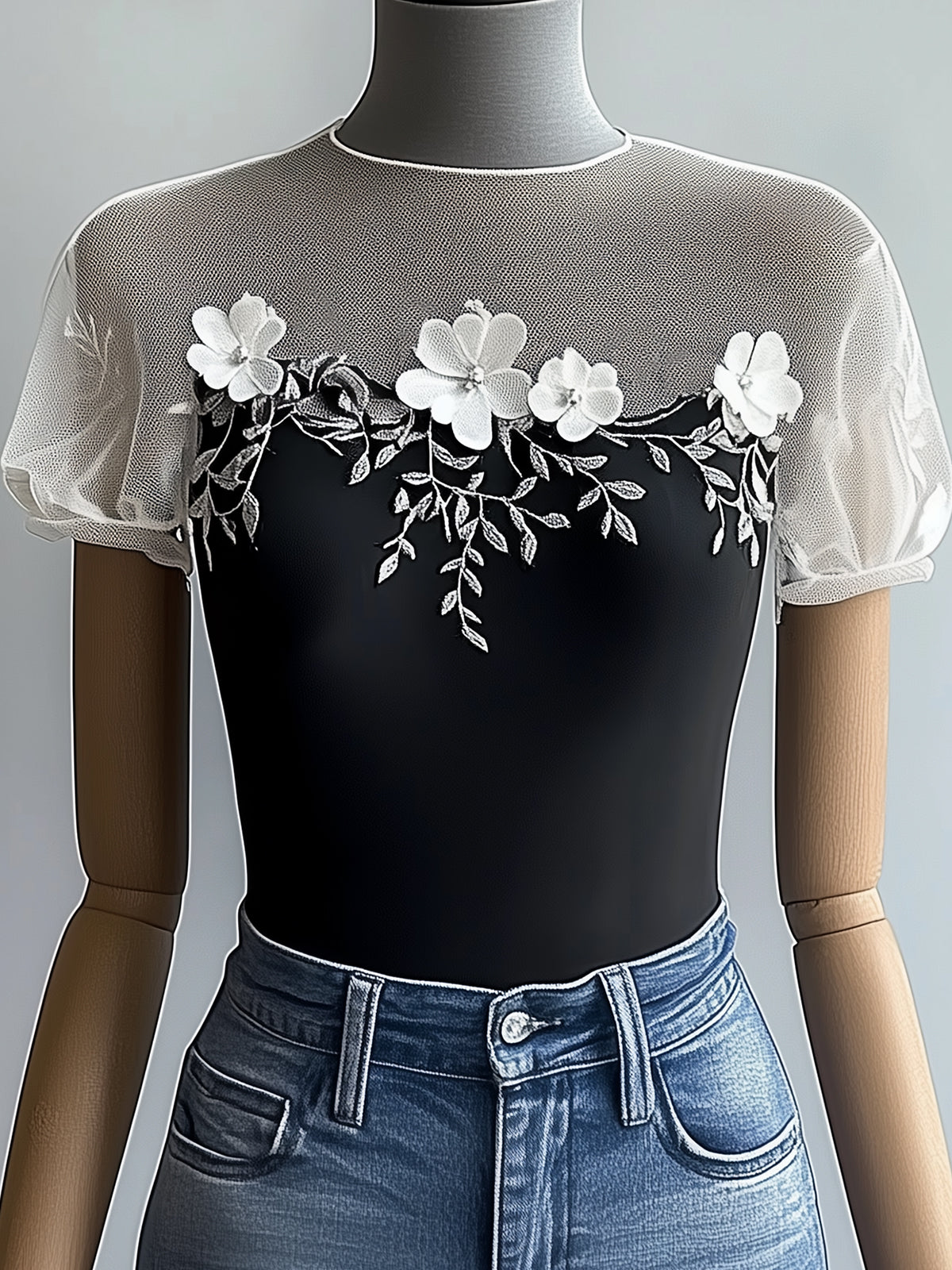 Black Short-Sleeve T-Shirt With Mesh Neckline And Sleeves Featuring Embroidered Applique Design