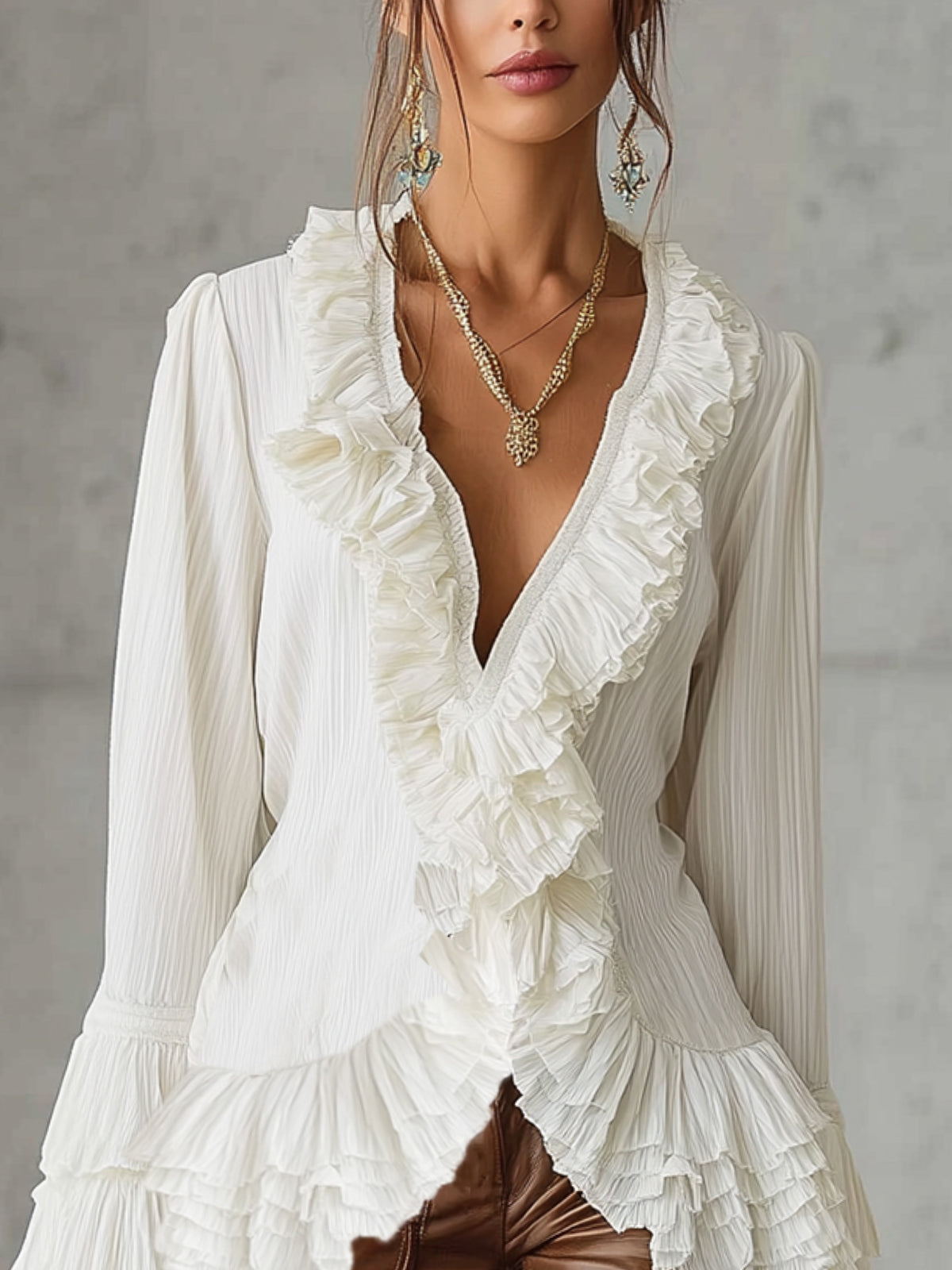 White Ruffled Blouse With Pleated Details And Flared Sleeves